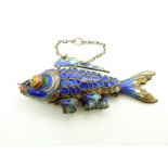 A silver fish pendant set with enamel, 7 x 3cm