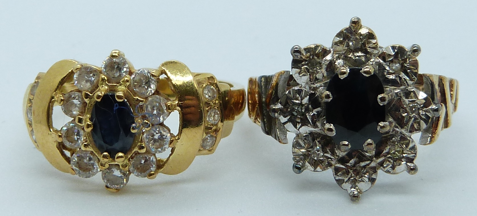 A 9ct gold ring set with a sapphire and diamonds and another yellow metal ring set with paste,