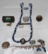 A collection of jewellery including beads, glass necklace, brooches including Victorian, Miracle,