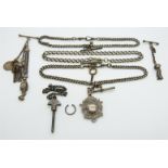 Three hallmarked silver fob chains/ Alberts, silver fob and charms