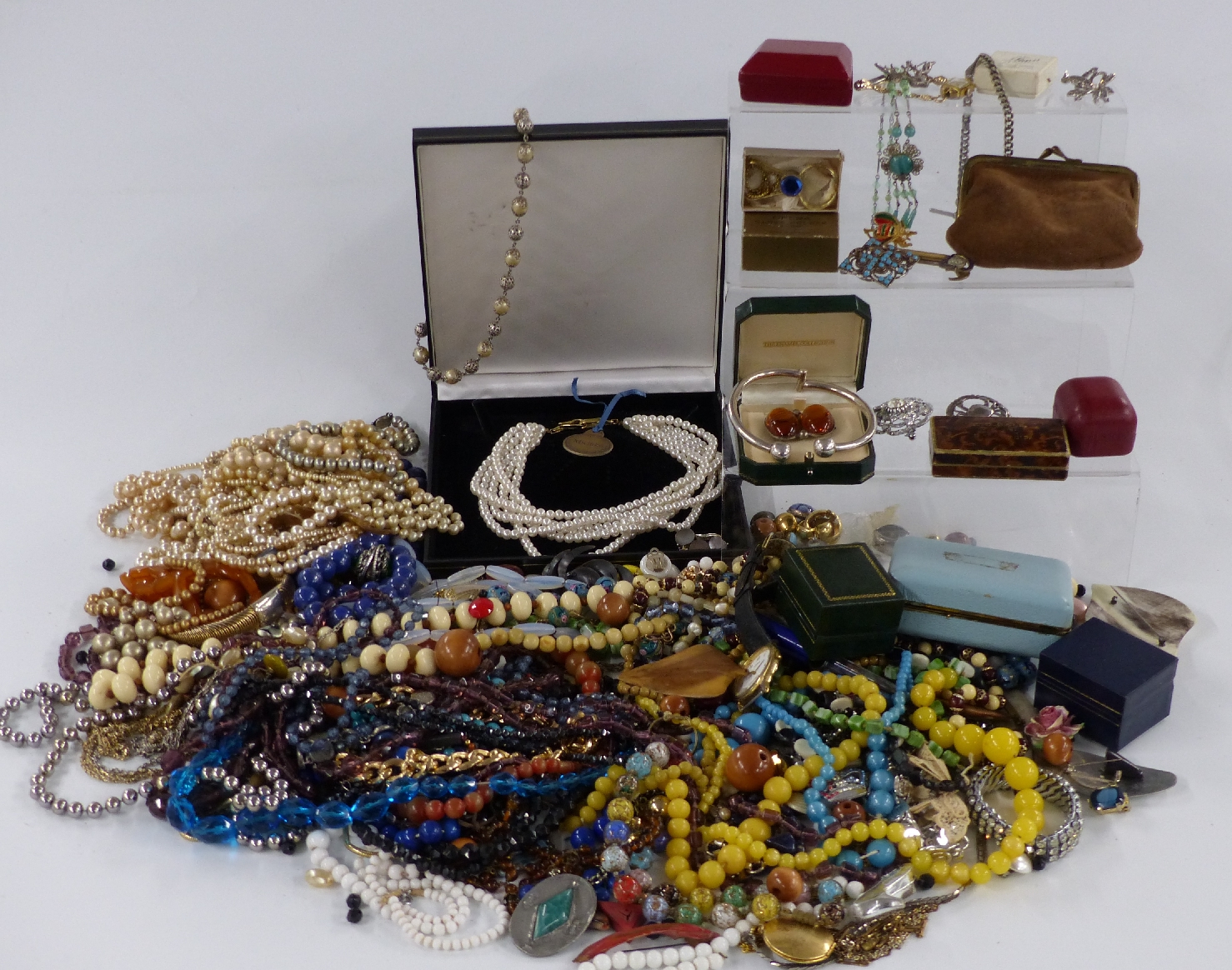 A collection of costume jewellery including glass beads, brooches, Czech necklace, silver bangle etc