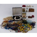 A collection of costume jewellery including glass beads, brooches, Czech necklace, silver bangle etc