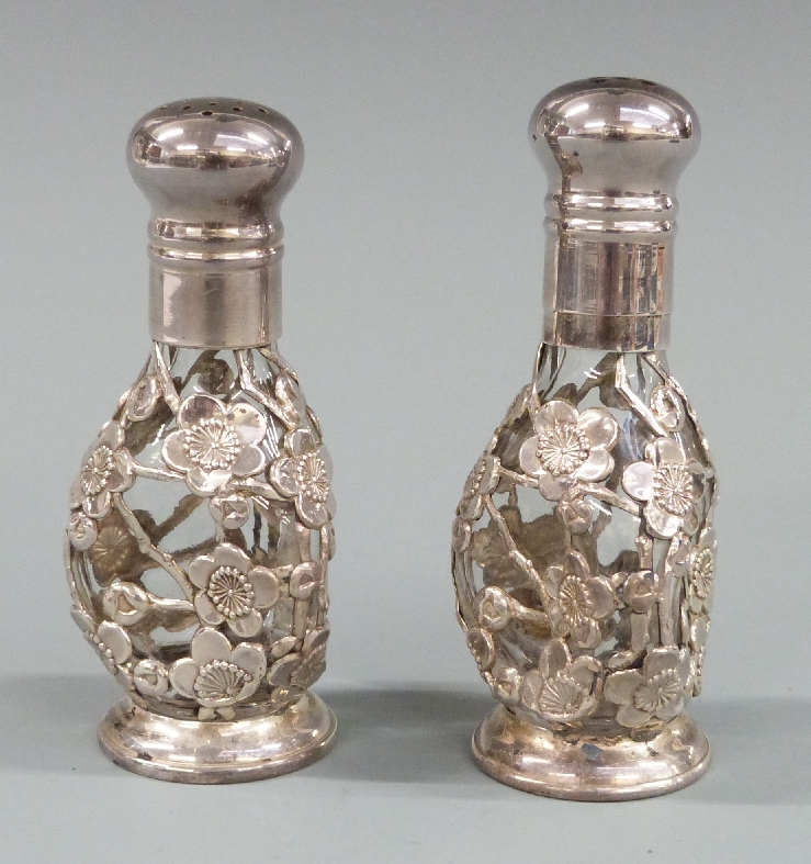 Cased pair of white metal mounted glass salt and peppers, impressed sterling 950, height 8cm