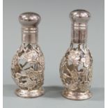 Cased pair of white metal mounted glass salt and peppers, impressed sterling 950, height 8cm