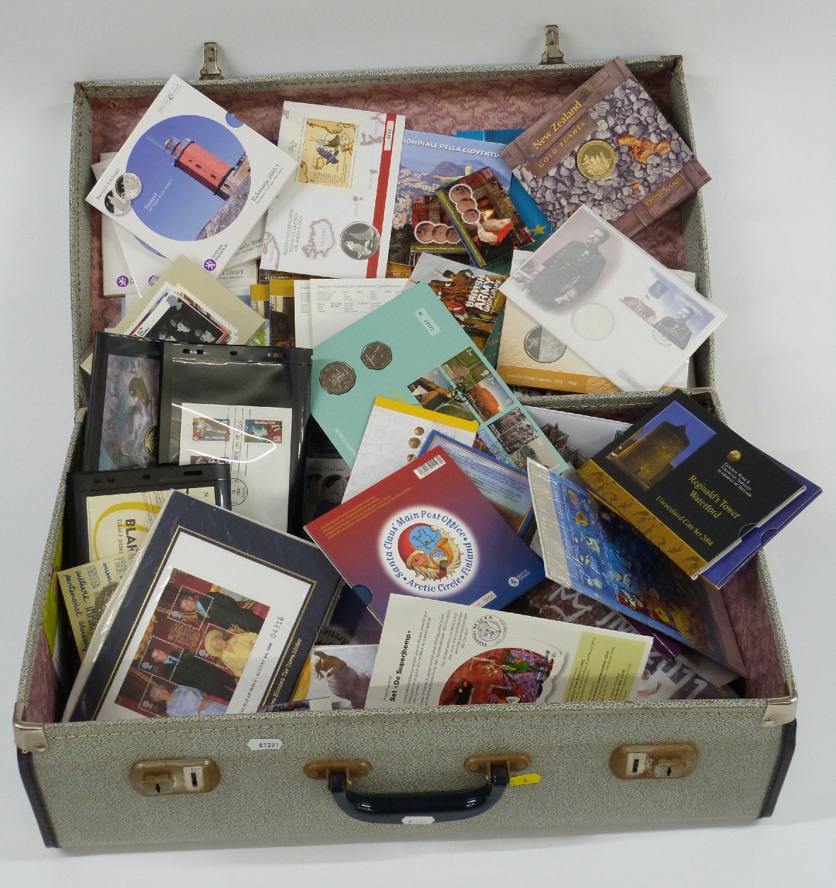 An extensive collection of largely European coin presentation packs, stamp first day coin covers