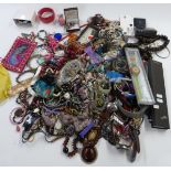 A collection of jewellery and watches including Swatch, amethyst pendant, earrings, necklaces,