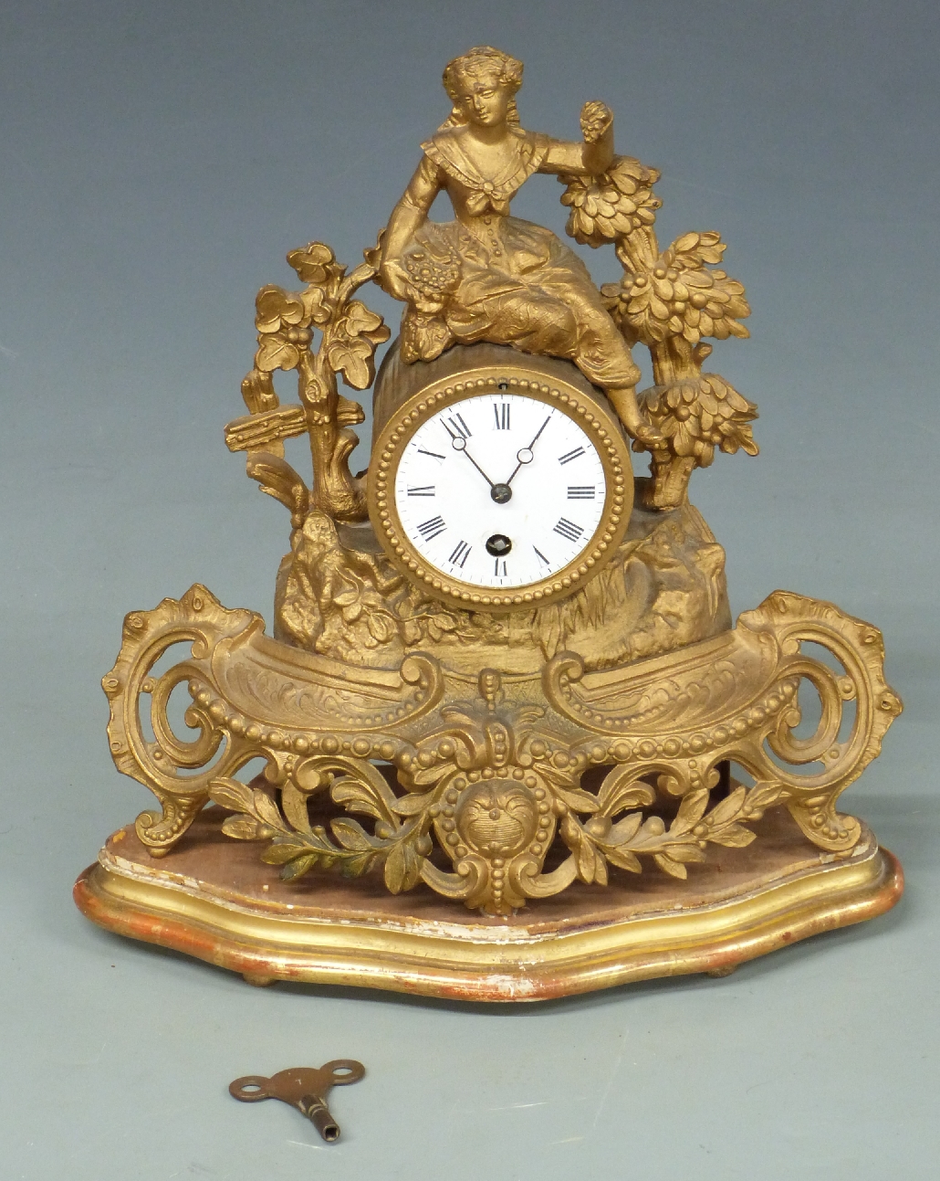 19thC French figural mantel clock, the Roman enamel dial with Breguet hands, the single train