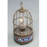 A c1950s bird-song automaton alarm clock, the case with cloisonné decoration to base, the orb dial