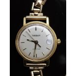 Tissot Seastar ladies wristwatch with date aperture, gold hands and baton markers and silver dial,