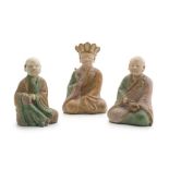 Three Chinese Ming style sancai-glazed stoneware figures of two monks and a deity, 20th century