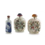 A pair of Chinese reverse painted glass snuff bottles, 20th century