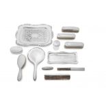 A miscellaneous group of electroplate and silver dressing table wares