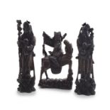 A pair of Chinese hardwood and silver-inlaid figures of Shou lao, early 20th century