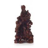 A Chinese hardwood carving of Shou-lao and children, 20th century