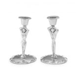 A pair of silvered pewter Carrol Boyes figural candlesticks, modern