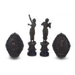 A pair of allegorical patinated bronze wall plaques, 19th/20th century