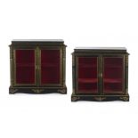 A pair of Louis XVI style ebonised and ormolu-mounted boulle side cabinets, 19th century