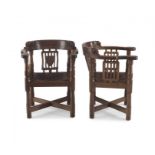 A pair of Robert 'Mouseman' Thompson of Kilburn oak armchairs, 1928