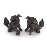 A pair of Chinese bronze dogs-of-fo, Qing Dynasty, 19th century