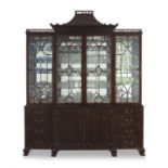 A Chippendale style flame mahogany breakfront bookcase, early 20th century