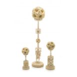 A Chinese ivory puzzle ball on stand, late 19th/early 20th century