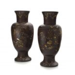 A pair of Japanese shakudo and silver overlaid bronze vases, Meiji period 1868-1912