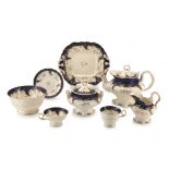 A Staffordshire royal blue, cream and gilt part tea and coffee set, 19th century