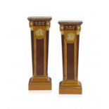 A pair of Empire style mahogany, birds-eye-maple and satinwood-veneered gilt-brass mounted pedestals