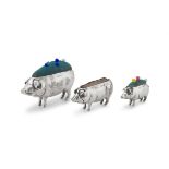 Three silver pig pin cushions, Adie & Lovekin Ltd, S & Co, maker's mark worn, Birmingham, 1906-1943