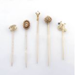 Collection of five gold and gem-set stick pins, 19th/20th century