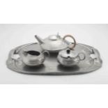 An assembled pewter tea service, Liberty & Co and W H Haseler, late 19th/early 20th century