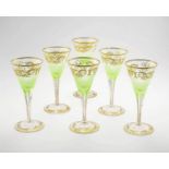 A set of six pale green and gilt flutes, 19th century