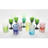 A quantity of drinking multi-coloured glasses