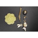 A 9ct gold fern leaf brooch, 1.8g; together with a carved jade flower pendant; and four other