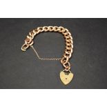 A 9ct gold link bracelet with padlock clasp, 22g.