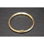 A 9ct gold hinged bangle, 6.4g.