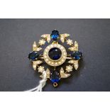 An unmarked yellow metal brooch/pendant set synthetic sapphires and split pearls, 30mm, 6g total