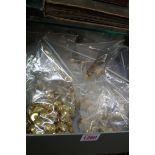 A large collection of brass military buttons.