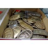 A collection of US brass belt buckles.