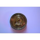 A 19th century George III commemorative brass circular snuff box and cover, 7.5cm diameter. A 19th