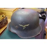 A German World War II helmet, with Luftwaffe transfer.