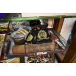 A collection of Naval items, to include cloth badges; epaulettes; brass buttons; and a two drawer