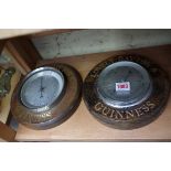 Two Guinness advertising beechwood framed aneroid wall barometers.