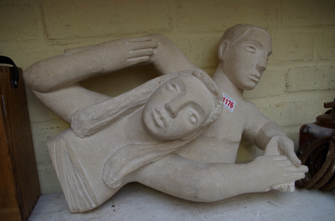 Josh Smith, a carved sandstone figure group, initialled and dated '92, 47cm wide.