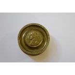 A brass Battle of Trafalgar snuff box and cover, 7cm diameter.