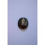 * Clare, 18th century, head and shoulders portrait miniature of a gentleman wearing a red jacket,