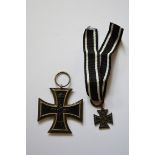 A small collection of early 20th century German ephemera, to include a World War I Iron Cross; and