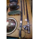 An antique cavalry sabre, with 85cm fullered blade, and having brass guard, in black painted steel