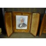 A pair of portrait miniatures in leather easel back frames, the miniatures 12 x 9.5cm.