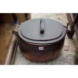 A 19th century copper oval cooking pot and cover, with steel swing handle, 43cm wide; together